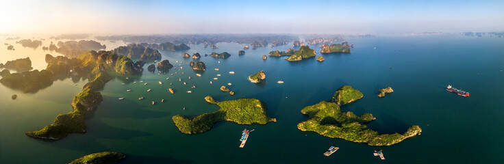 Aerial view floating fishing village and rock island, Halong Bay, Vietnam, Southeast Asia. UNESCO World Heritage Site. Junk boat cruise to Ha Long Bay. Popular landmark, famous destination of Vietnam © Hien Phung