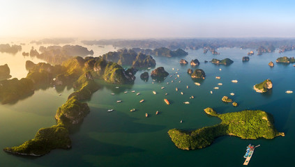 Aerial view floating fishing village and rock island, Halong Bay, Vietnam, Southeast Asia. UNESCO World Heritage Site. Junk boat cruise to Ha Long Bay. Popular landmark, famous destination of Vietnam © Hien Phung