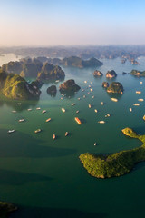 Aerial view floating fishing village and rock island, Halong Bay, Vietnam, Southeast Asia. UNESCO World Heritage Site. Junk boat cruise to Ha Long Bay. Popular landmark, famous destination of Vietnam © Hien Phung