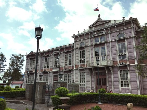 Low Angle View Of School Building Against Cloudy Sky