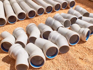 Plastic parts of sewage pipeline system at construction site