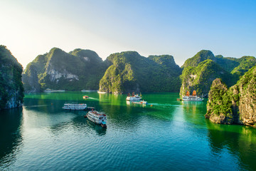 Aerial view floating fishing village and rock island, Halong Bay, Vietnam, Southeast Asia. UNESCO...