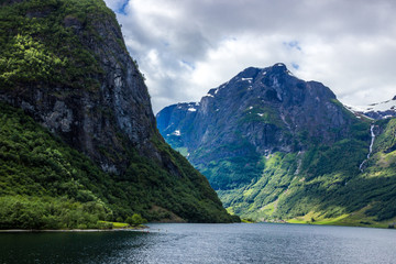 Fototapeta premium clouds over Naeroyfjord in Western Norway