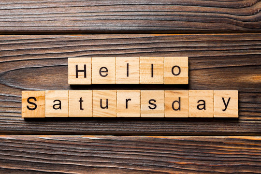 hello saturday word written on wood block. hello saturday text on wooden table for your desing, concept