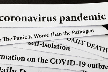 Coronavirus breaking news headline clippings from various newspapers reporting on the deadly disease.