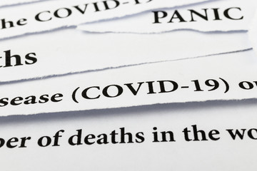Coronavirus breaking news headline clippings from various newspapers reporting on the deadly disease.