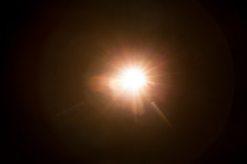 Abstract Natural Sun flare on the black background.