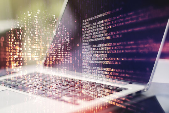 Creative code skull hologram on modern computer background, cybercrime and hacking concept. Multiexposure