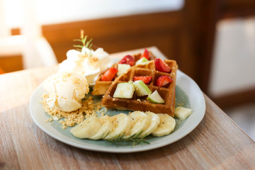Waffle of fresh berries  strawberry, blueberry, bananas and chocolate topping,Sweet dessert cafe