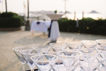 many clean martini cocktail glass at seaside dinner