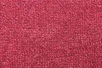 Fototapeta premium The texture of a thick fabric of red color. Macro. Russia.