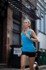 Woman Runner in the back streets of Boston city