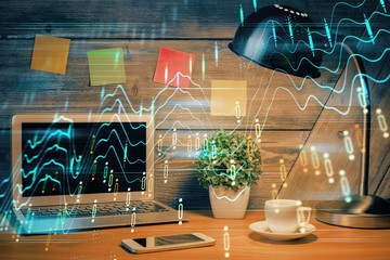 Multi exposure of chart and financial info and work space with computer background. Concept of...