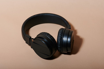 Fototapeta na wymiar Black audio wireless headphones
