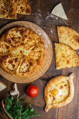 Georgian khachapuri on the table. Homemade baking. Top view.