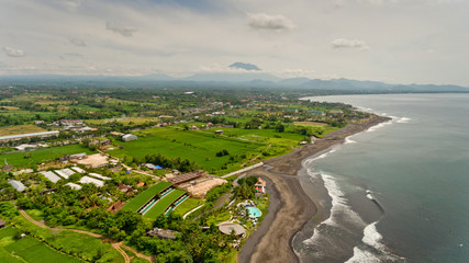 Fototapeta premium Aerial view of black sand beach. Surfing beach Bali, Indonesia.
