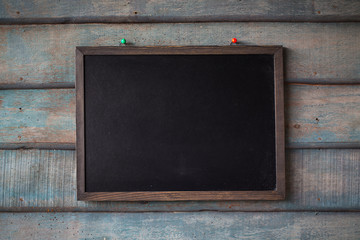 Clean chalk board on wooden background . texture for educational or business background.