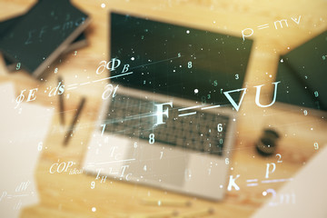 Creative scientific formula concept on modern laptop background. Multiexposure