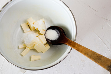 crushed butter in a saucepan with a spoonful of baking powder for making a pie
