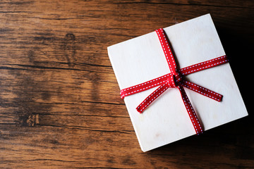red gift box on wooden background