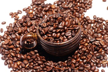 Wooden  cup and coffee  bean on  isolate white background  , selective focus .
