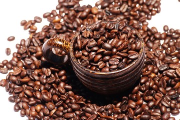 Wooden  cup and coffee  bean on  isolate white background  , selective focus .