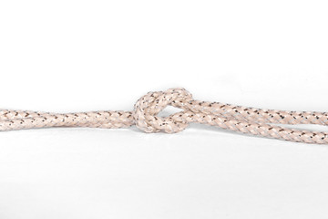 silver rope with knot against white background