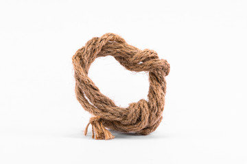 Old brown roped against a white background