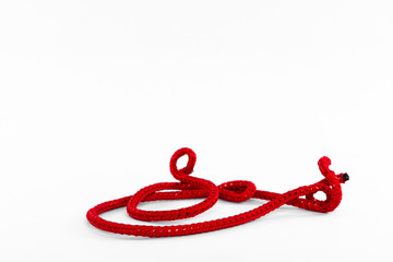 Red string on a white background