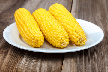 Corn on the background of the wooden planks