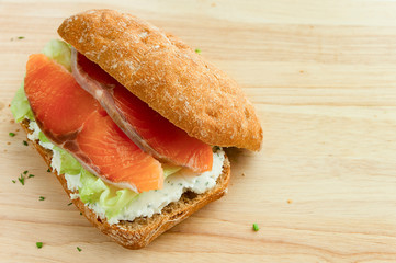 salmon sandwich with dill cheese and iceberg lettuce