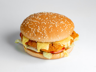 chicken burger with cheese and vegetables