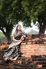 Beautiful south east asian girl in traditional Indian sari/saree