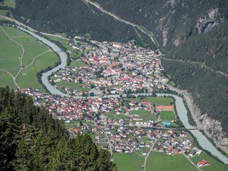 Aerial view of village Pfunds, Upper Inn Valley, Tyrol, Austria, as seen from the summit of peak...