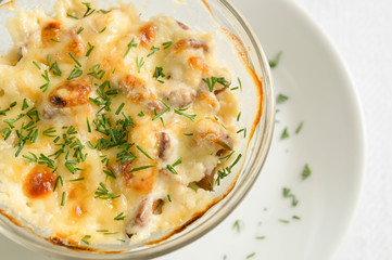 julienne with mushrooms, covered with cheese crust and sprinkled with dill