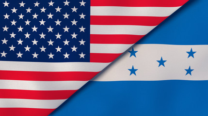 Fototapeta premium The flags of United States and Honduras. News, reportage, business background. 3d illustration