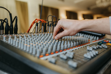 Close up hand of music engineer