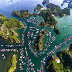 Floating fishing village and rock island in " Lan Ha " Bay, Vietnam, Southeast Asia. UNESCO World Heritage Site. Landscape. Popular landmark, famous destination of Vietnam. Near " Ha Long " bay © Hien Phung