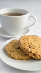 oatmeal cookies served with a cup of tea