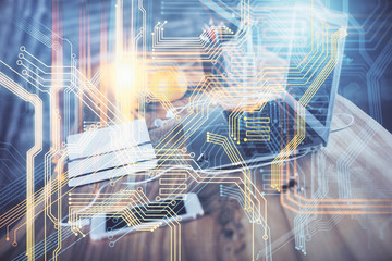 Multi exposure of table with computer and world map hologram. International data network concept.