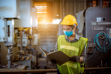 Portrait woman worker under inspection and checking production process on factory station by...