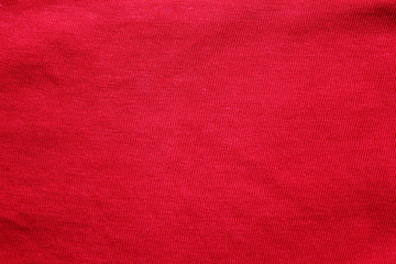 Red fabric texture background, empty cotton red cloth wallpaper. Soft textile material, close up...