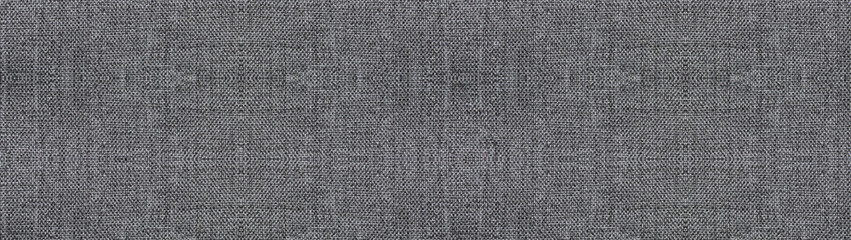 Grey fabric texture background, light gray empty cloth canvas. Cotton material backdrop, smooth gray blank wide surface wallpaper with copy space. Soft light surface, horizontal elongated linen banner