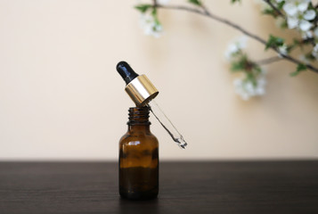 Cosmetic or medical glass bottle with pipette. Skin care concept. Place for text.