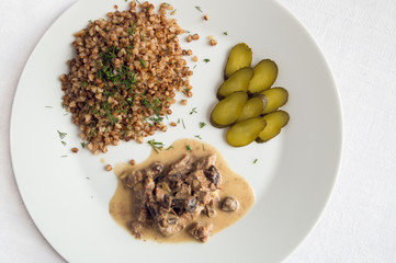 beef stroganoff with honey agarics served with buckwheat and pikcled cucumber.