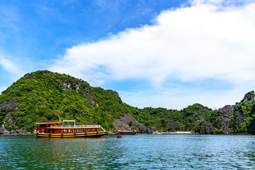 Floating fishing village and rock island in " Lan Ha " Bay, Vietnam, Southeast Asia. UNESCO World Heritage Site. Landscape. Popular landmark, famous destination of Vietnam. Near " Ha Long " bay