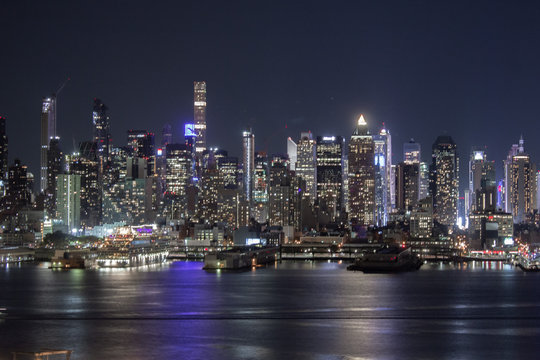 New York City with buildings, streets, during clear night