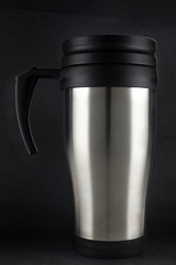 stainless coffee cup on black background