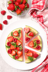 watermelon slices with berries fruits- top view