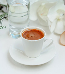 coffee cup and still water on the table